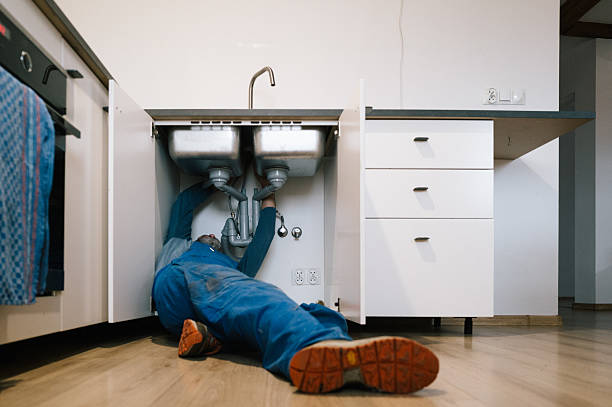 Professional Emergency Plumber technician working in Mc Connellsburg, PA
